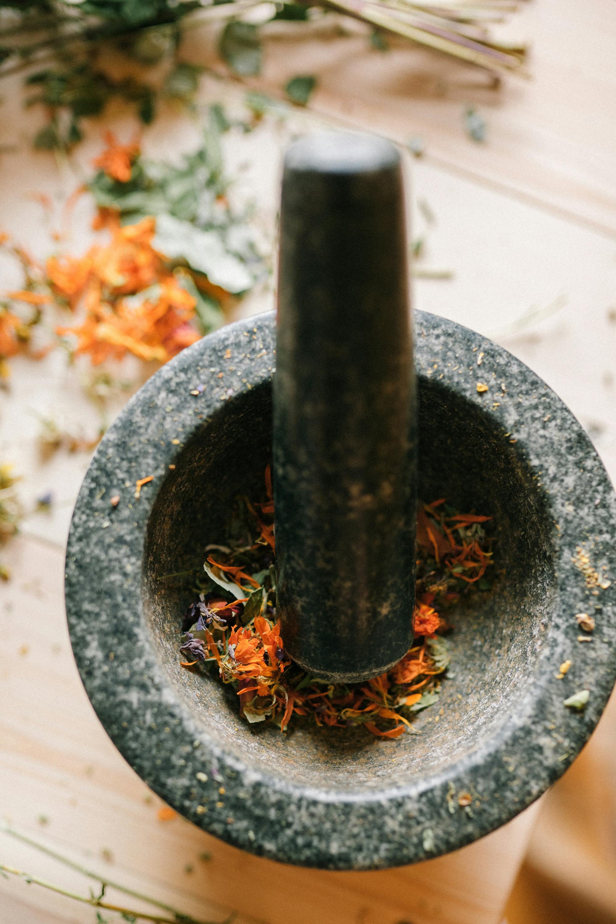 Mortar with dried herbs and botanicals